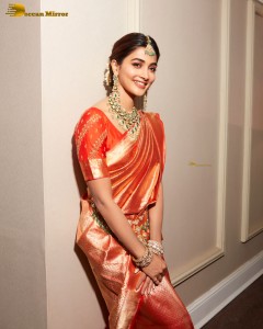 actress pooja hegde photoshoot in a red saree and jewelry