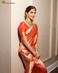 actress pooja hegde photoshoot in a red saree and jewelry