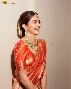 actress pooja hegde photoshoot in a red saree and jewelry