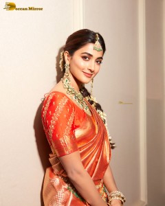 actress pooja hegde photoshoot in a red saree and jewelry