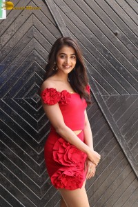 actress pooja hegde in a short red dress