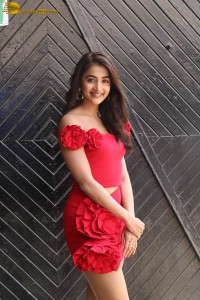 actress pooja hegde in a short red dress