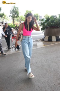 actress pooja hegde cute in a pink top and denim jeans at airport