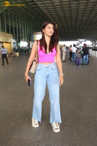 actress pooja hegde cute in a pink top and denim jeans at airport