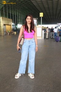 actress pooja hegde cute in a pink top and denim jeans at airport
