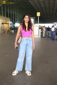 actress pooja hegde cute in a pink top and denim jeans at airport