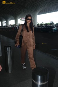 actress pooja hegde in a brown dress at airport