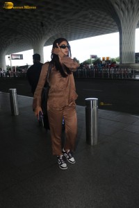 actress pooja hegde in a brown dress at airport
