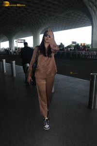actress pooja hegde in a brown dress at airport