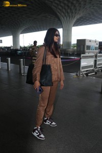 actress pooja hegde in a brown dress at airport