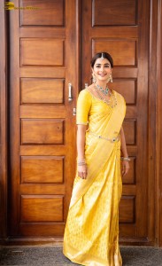 actress Pooja Hegde stunning looks in a yellow saree