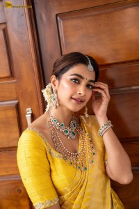 actress Pooja Hegde stunning looks in a yellow saree