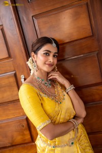 actress Pooja Hegde stunning looks in a yellow saree