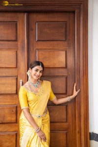 actress Pooja Hegde stunning looks in a yellow saree