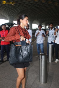 actress pooja hegde beautiful in a mini skirt at mumbai airport
