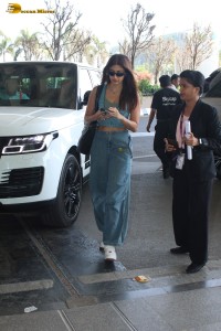 Indian actress pooja hegde in a sleeveless top and jeans at mumbai airport