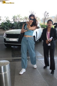 Indian actress pooja hegde in a sleeveless top and jeans at mumbai airport