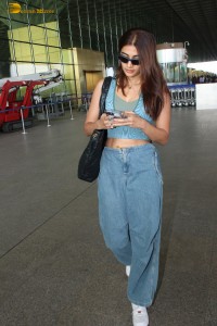 Indian actress pooja hegde in a sleeveless top and jeans at mumbai airport