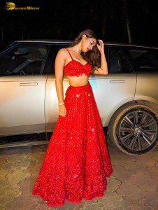actress Pooja Hegde glamorous photo shoot in a red dress