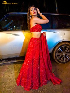 actress Pooja Hegde glamorous photo shoot in a red dress