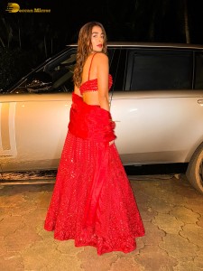 actress Pooja Hegde glamorous photo shoot in a red dress