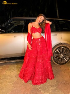actress Pooja Hegde glamorous photo shoot in a red dress