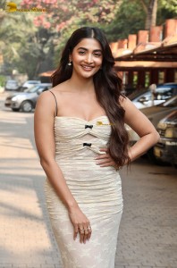 actress Pooja Hegde pretty in a noodle strap white dress