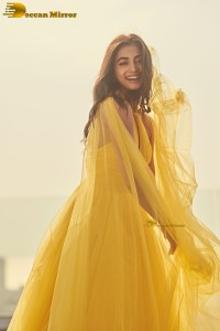 actress Pooja Hegde beautiful photo shoot in a yellow dress