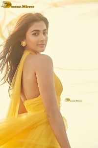 actress Pooja Hegde beautiful photo shoot in a yellow dress