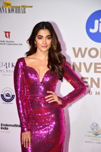 actress pooja hegde dazzling in a shiny pink dress at miss world event