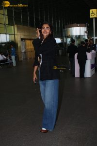 actress pooja hegde in white top and blue jeans at mumbai airport