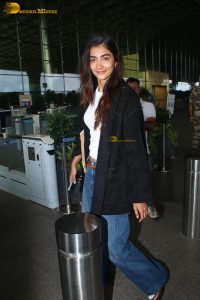 actress pooja hegde in white top and blue jeans at mumbai airport