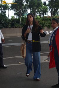 actress pooja hegde in white top and blue jeans at mumbai airport
