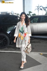 actress pooja hegde cute in a white salwar dress with floral design