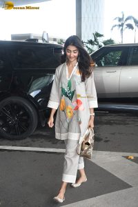 actress pooja hegde cute in a white salwar dress with floral design
