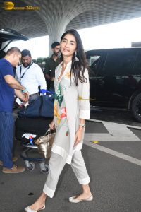 actress pooja hegde cute in a white salwar dress with floral design
