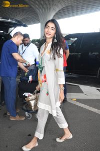 actress pooja hegde cute in a white salwar dress with floral design