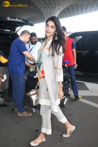 actress pooja hegde cute in a white salwar dress with floral design