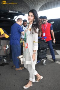 actress pooja hegde cute in a white salwar dress with floral design