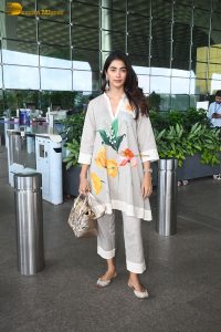 actress pooja hegde cute in a white salwar dress with floral design