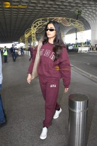 actress pooja hegde cute in red tracksuit at airport