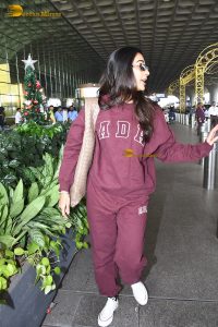 actress pooja hegde cute in red tracksuit at airport