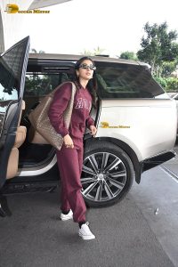 actress pooja hegde cute in red tracksuit at airport