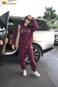 actress pooja hegde cute in red tracksuit at airport