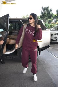actress pooja hegde cute in red tracksuit at airport