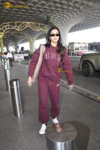 actress pooja hegde cute in red tracksuit at airport