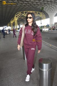 actress pooja hegde cute in red tracksuit at airport