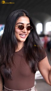 actress pooja hegde stylish and sexy in brown top and sunglasses