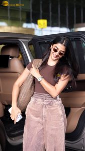 actress pooja hegde stylish and sexy in brown top and sunglasses
