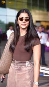 actress pooja hegde stylish and sexy in brown top and sunglasses